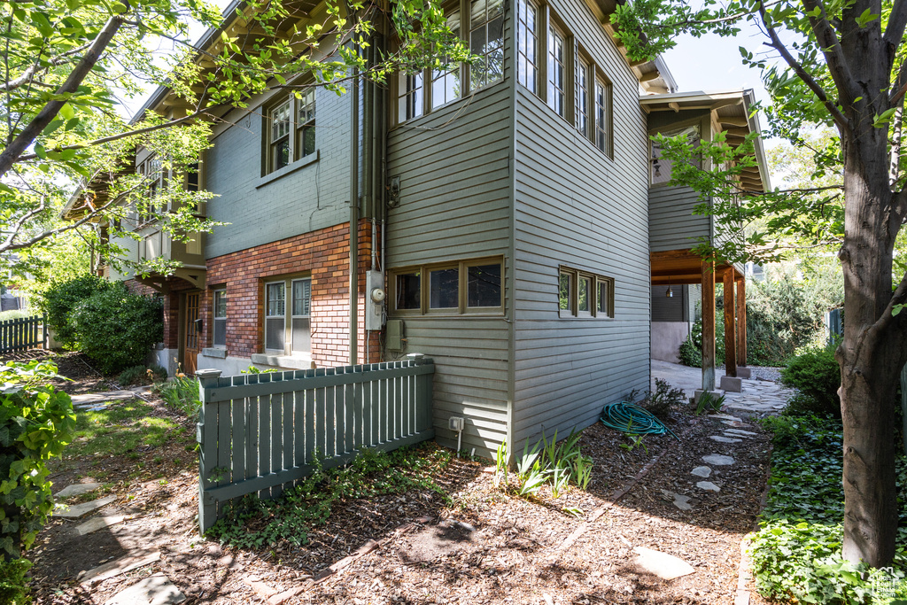 View of side of home featuring brick siding