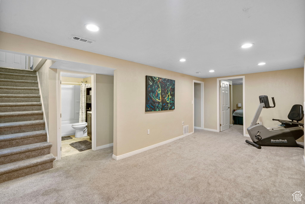 Exercise area featuring recessed lighting, carpet floors, and baseboards