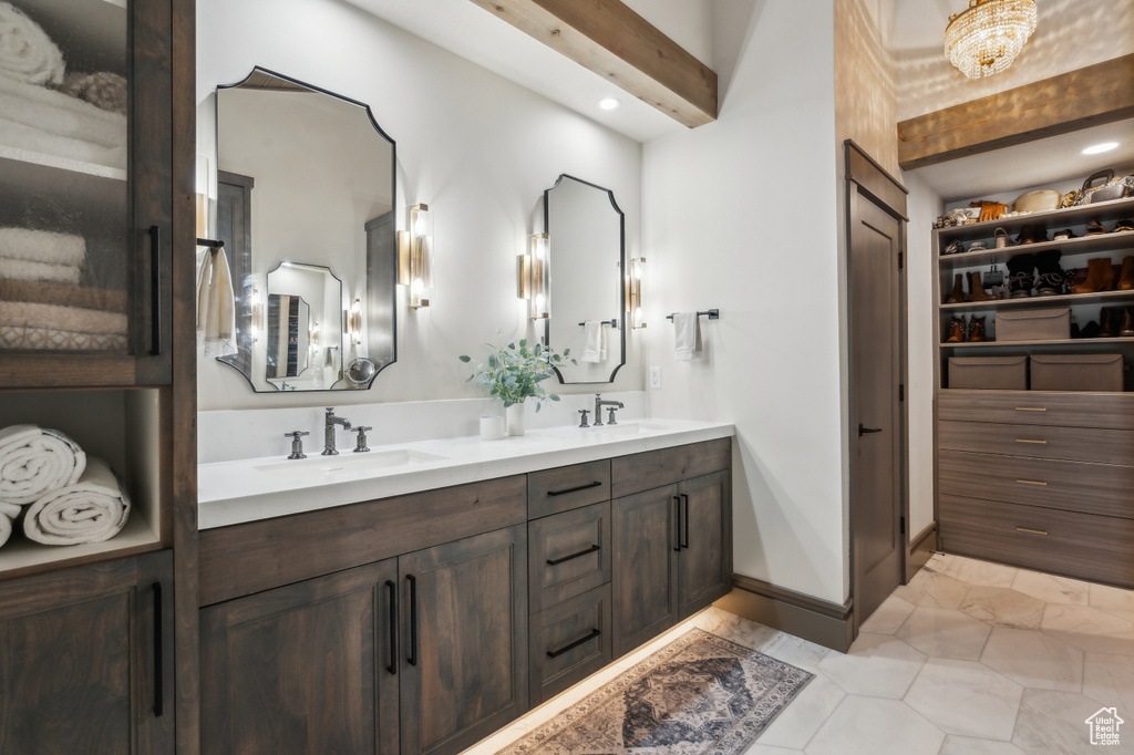 Full bath with double vanity, tile patterned flooring, and recessed lighting