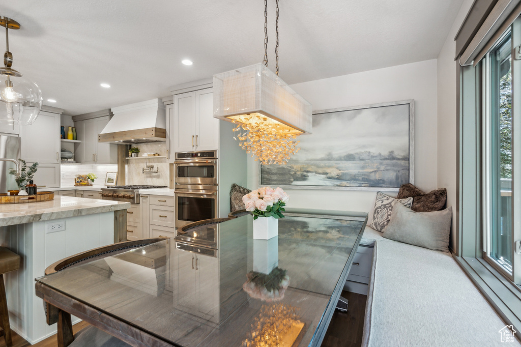 Dining room featuring recessed lighting and wood finished floors
