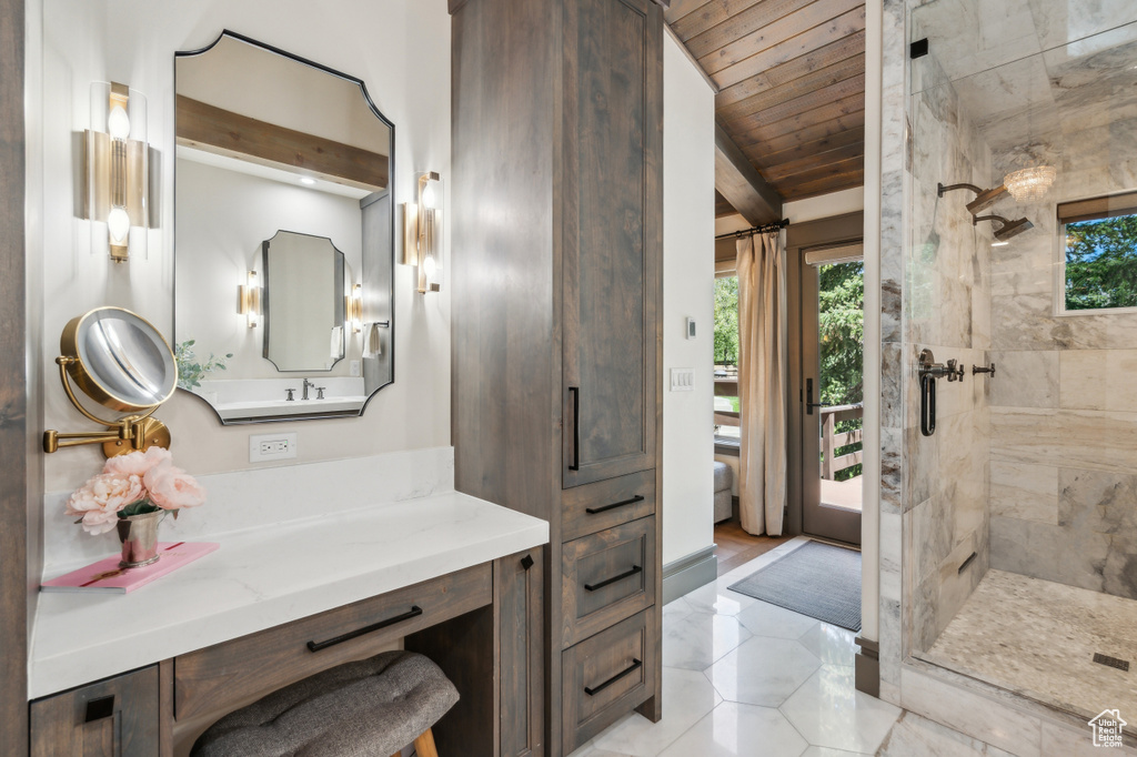 Bathroom featuring a stall shower, vanity, wooden ceiling, and tile patterned flooring