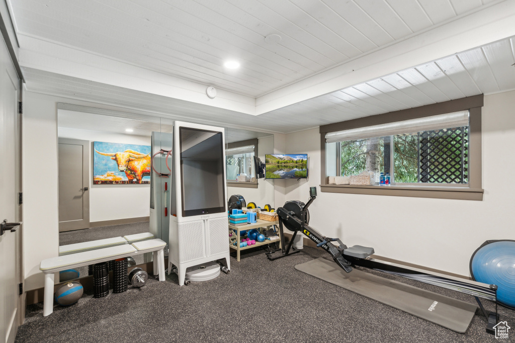 Exercise area with wooden ceiling and baseboards