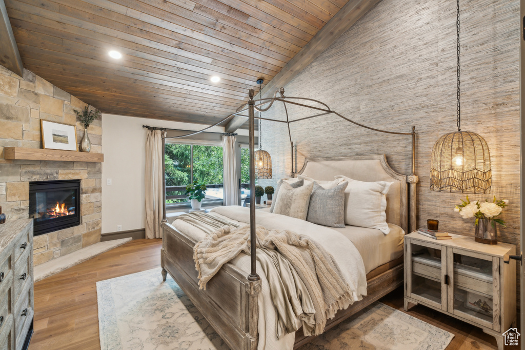 Bedroom with wooden ceiling, high vaulted ceiling, a fireplace, recessed lighting, and wood finished floors