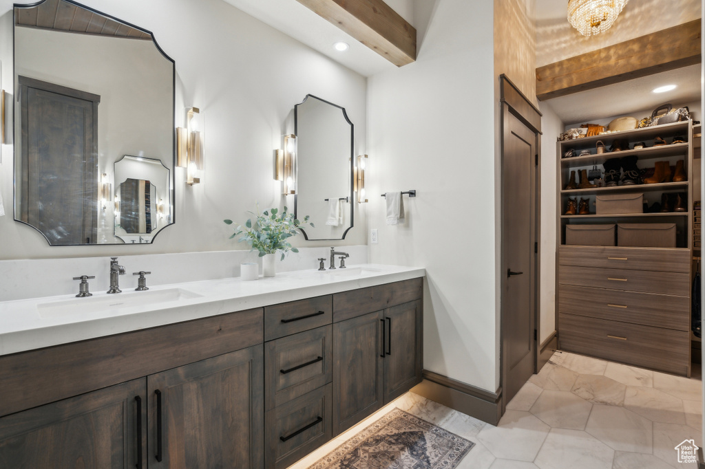 Bathroom with double vanity and recessed lighting