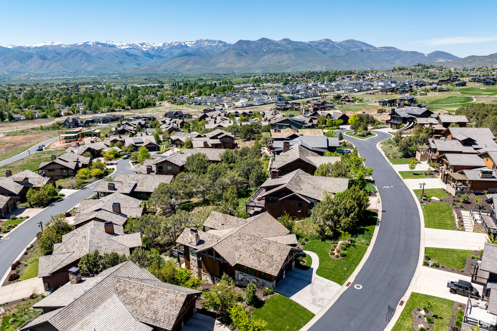 Aerial view of residential area featuring a mountain backdrop