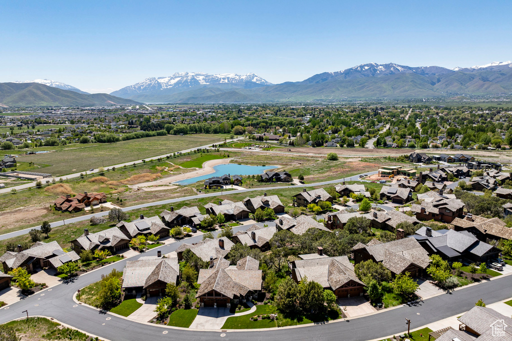 Aerial view of residential area featuring a water and mountain view