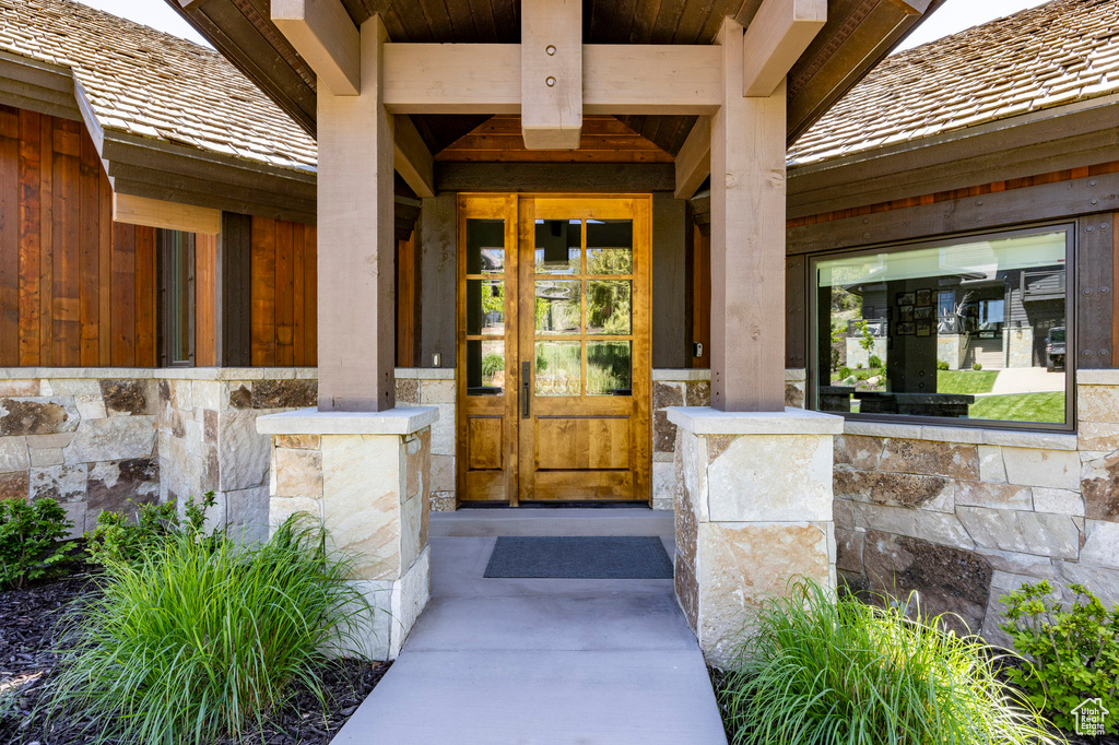 Property entrance with stone siding