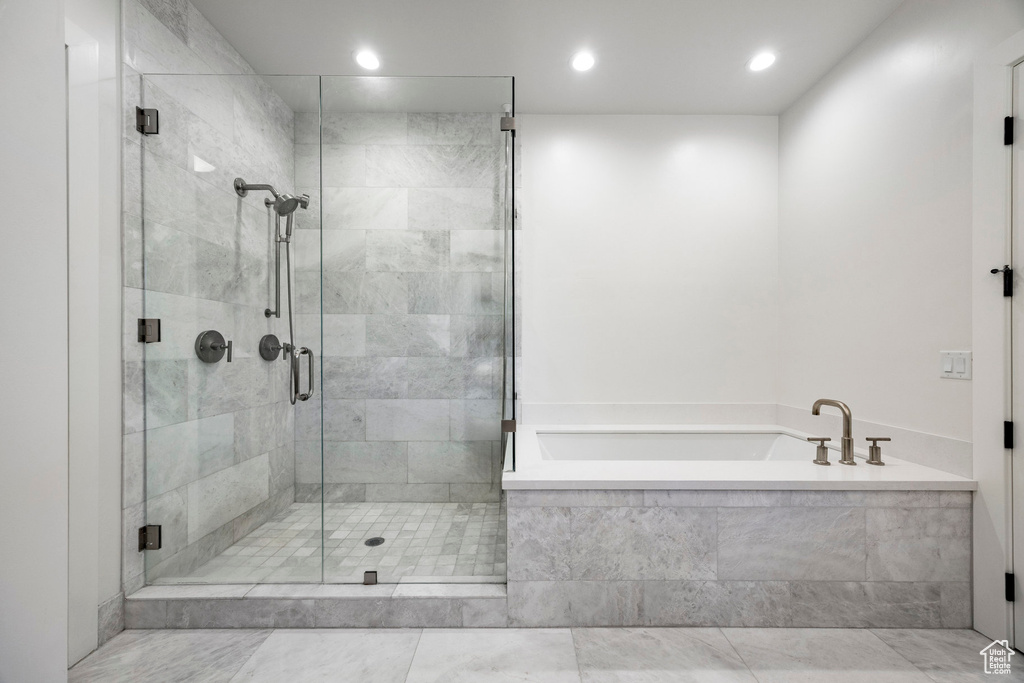 Full bathroom with a garden tub, a shower stall, and recessed lighting