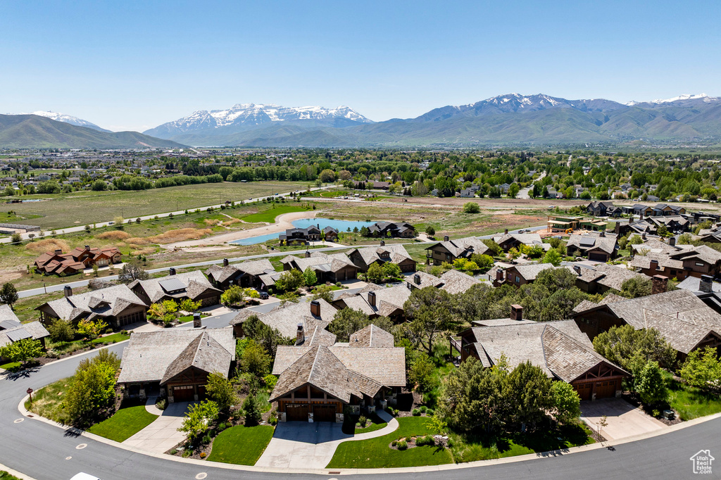Aerial view of residential area featuring a water and mountain view
