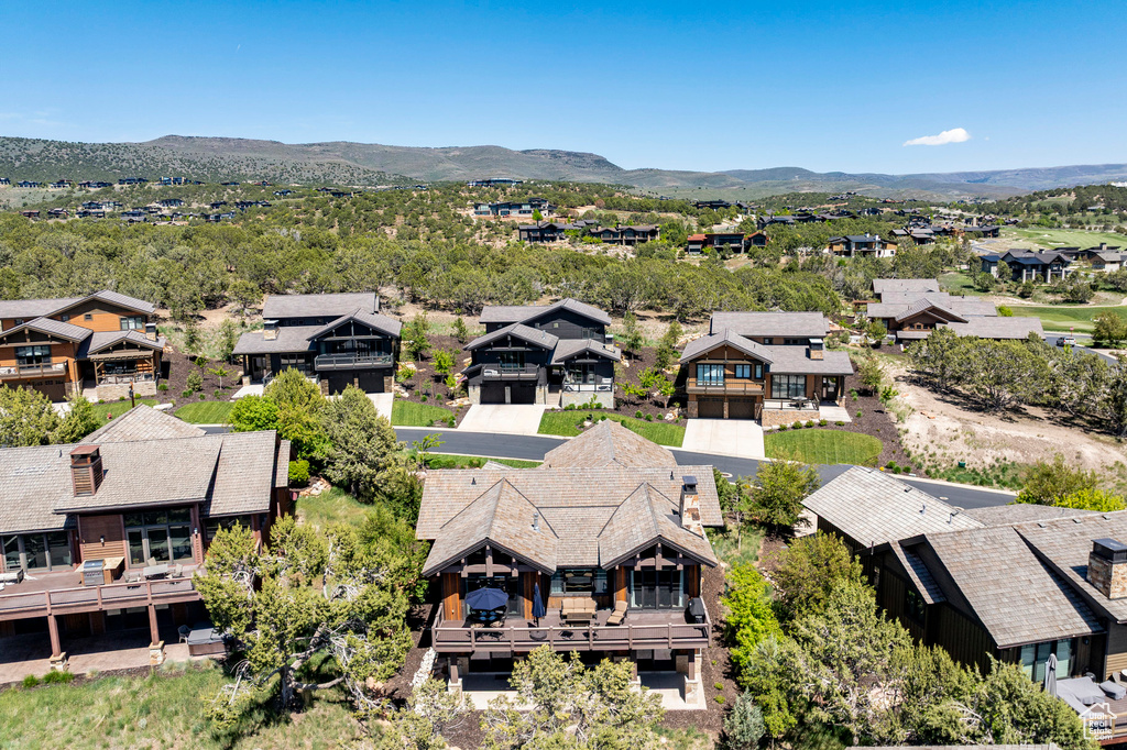 Aerial perspective of suburban area featuring a mountain backdrop