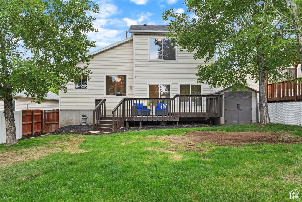 Rear view of property featuring a deck