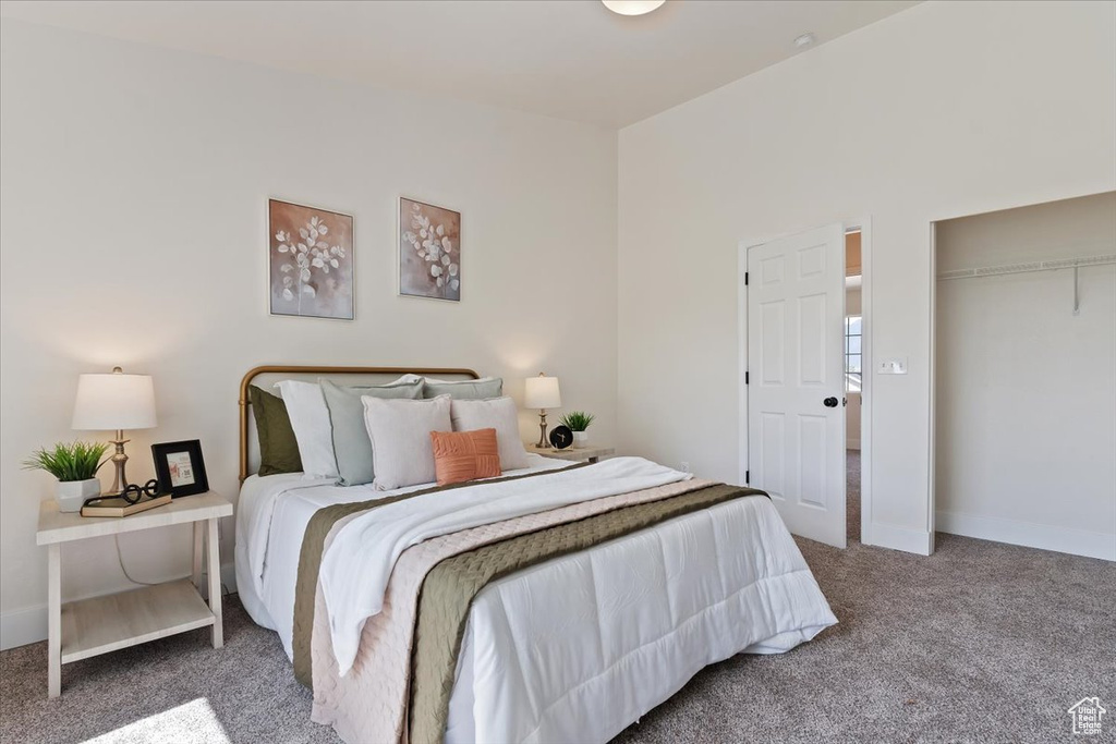 Bedroom with carpet floors and baseboards