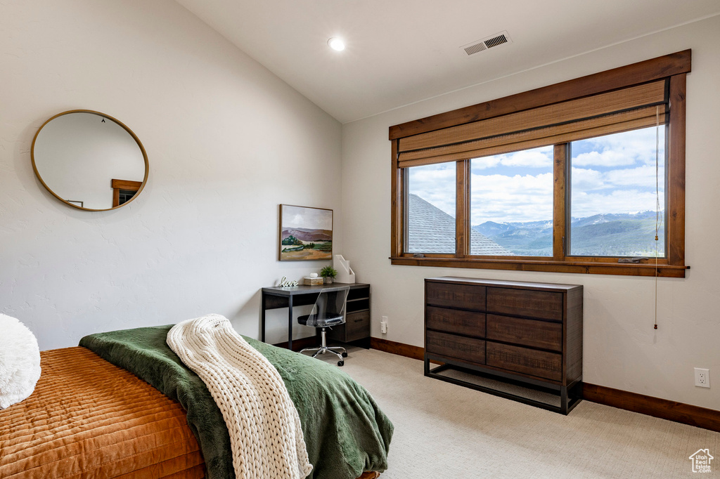 Bedroom with carpet floors, vaulted ceiling, baseboards, and recessed lighting