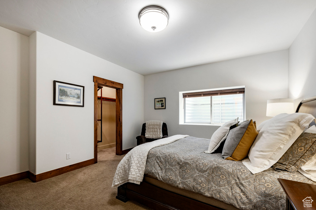 Carpeted bedroom with baseboards