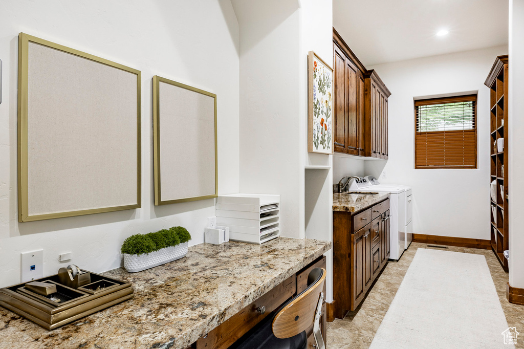 Laundry area with cabinet space, washer and dryer, and recessed lighting