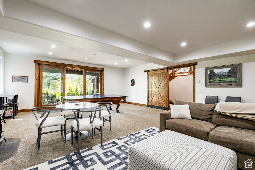 Living area featuring a barn door, light carpet, recessed lighting, baseboards, and billiards table