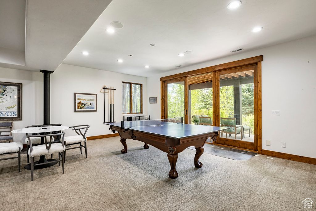 Playroom featuring light colored carpet, baseboards, and recessed lighting