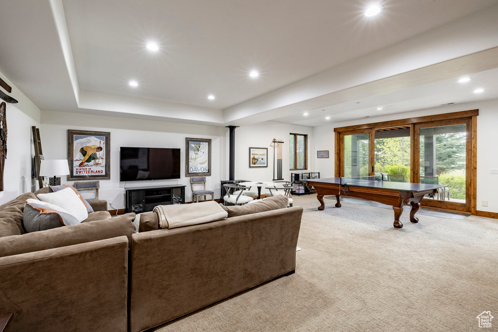 Living area with light carpet, recessed lighting, a tray ceiling, billiards, and baseboards