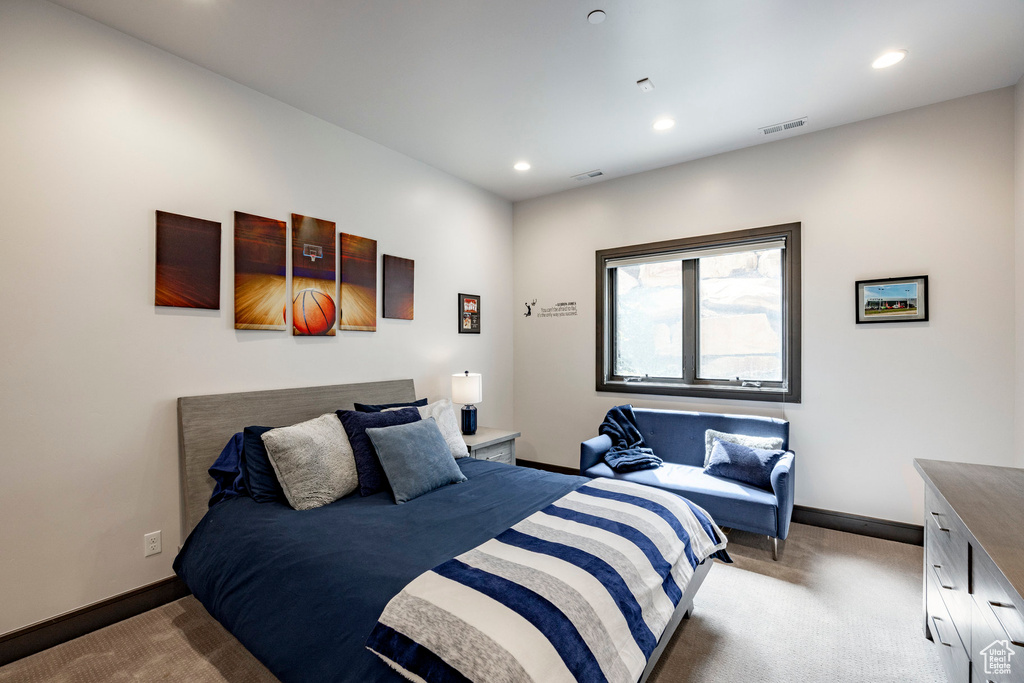 Carpeted bedroom featuring recessed lighting and baseboards