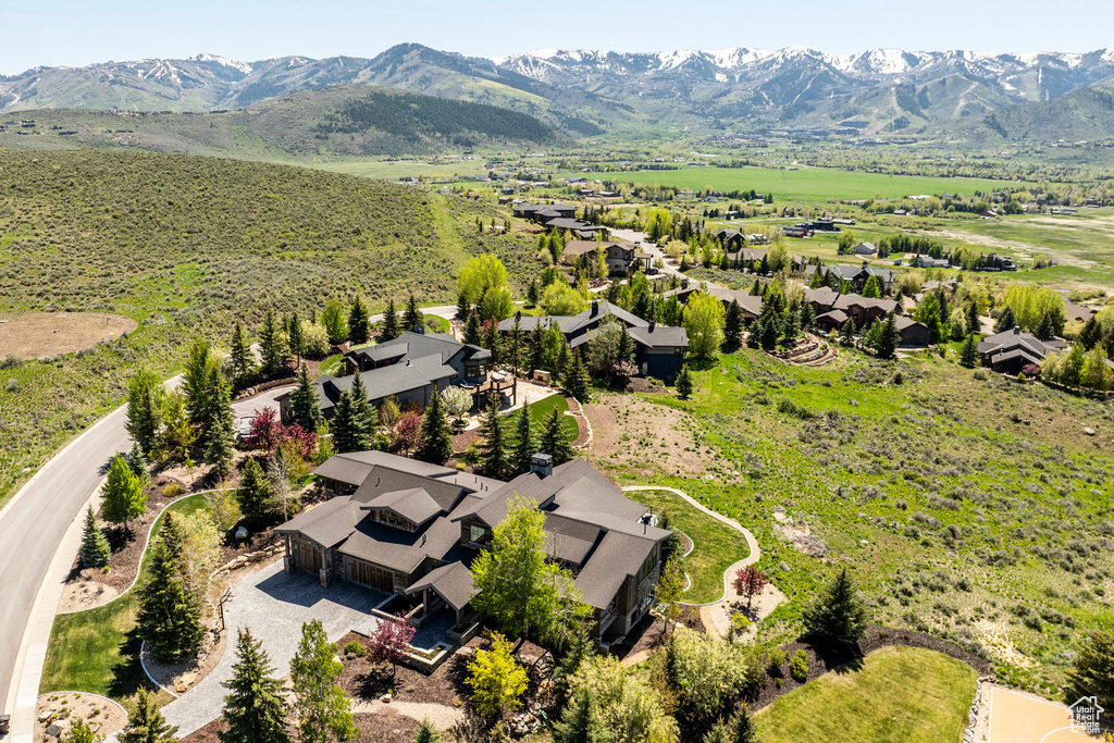 Aerial view of residential area featuring mountains