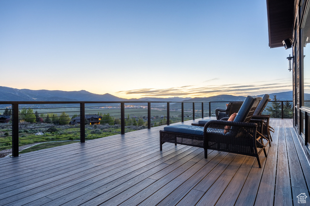 Wooden deck featuring a mountain view