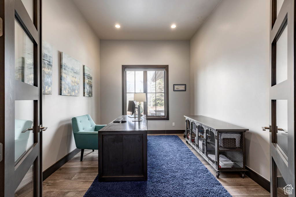 Office space featuring dark wood-style floors, baseboards, french doors, and recessed lighting