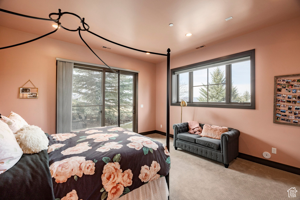 Bedroom with multiple windows, carpet flooring, access to exterior, baseboards, and recessed lighting