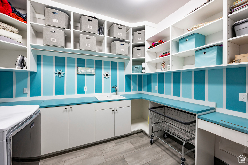 Pantry featuring a sink