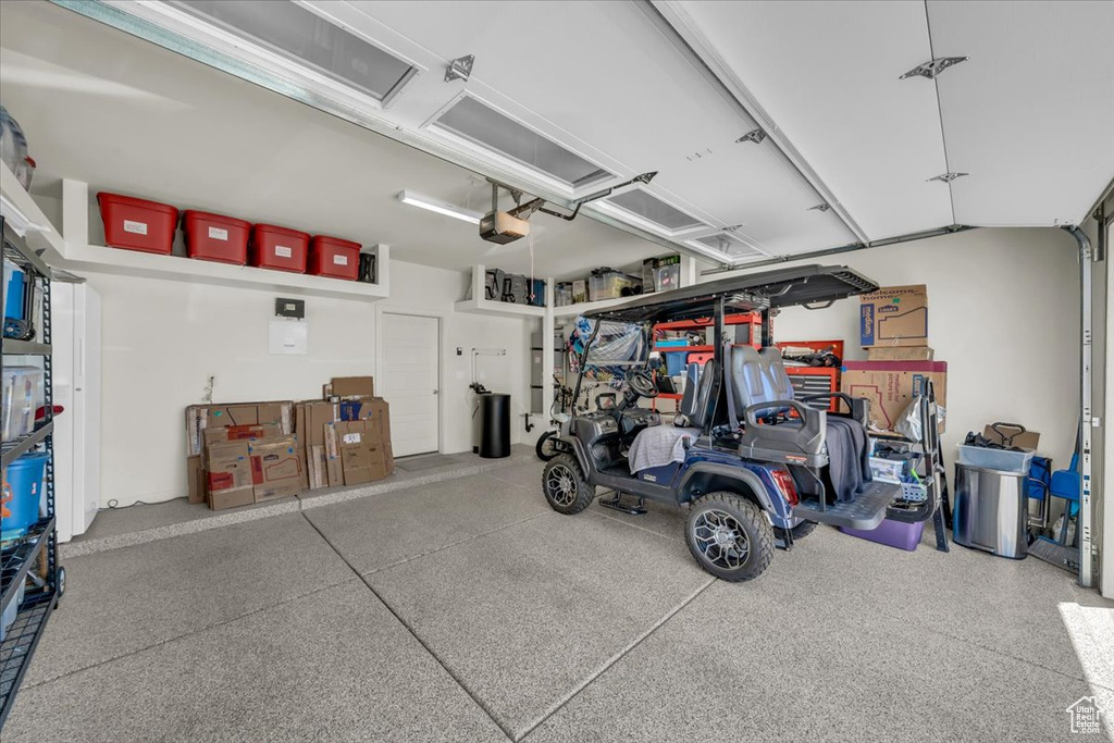 Garage featuring a garage door opener