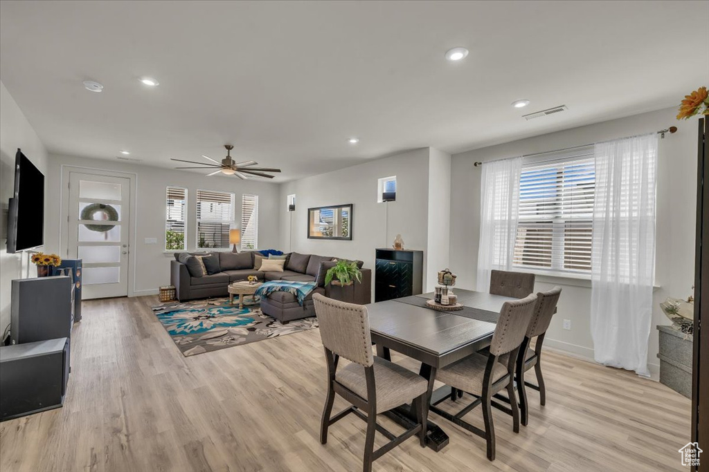 Dining room featuring light wood-style flooring, recessed lighting, a ceiling fan, and baseboards