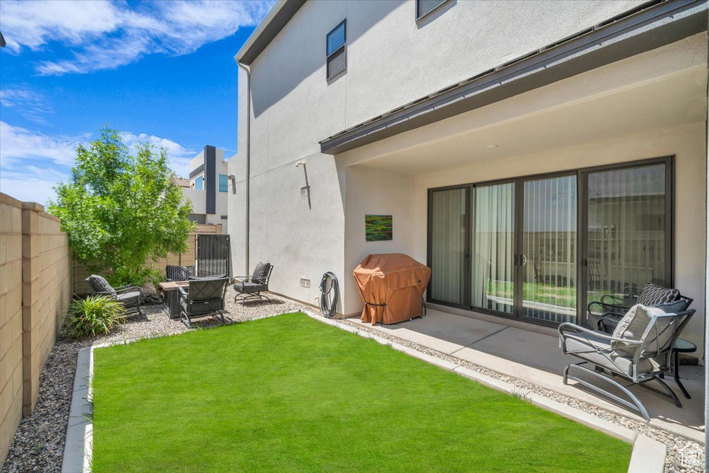View of yard with a patio and a fire pit