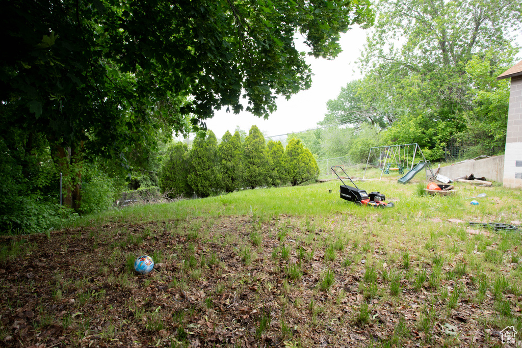 View of yard featuring a playground