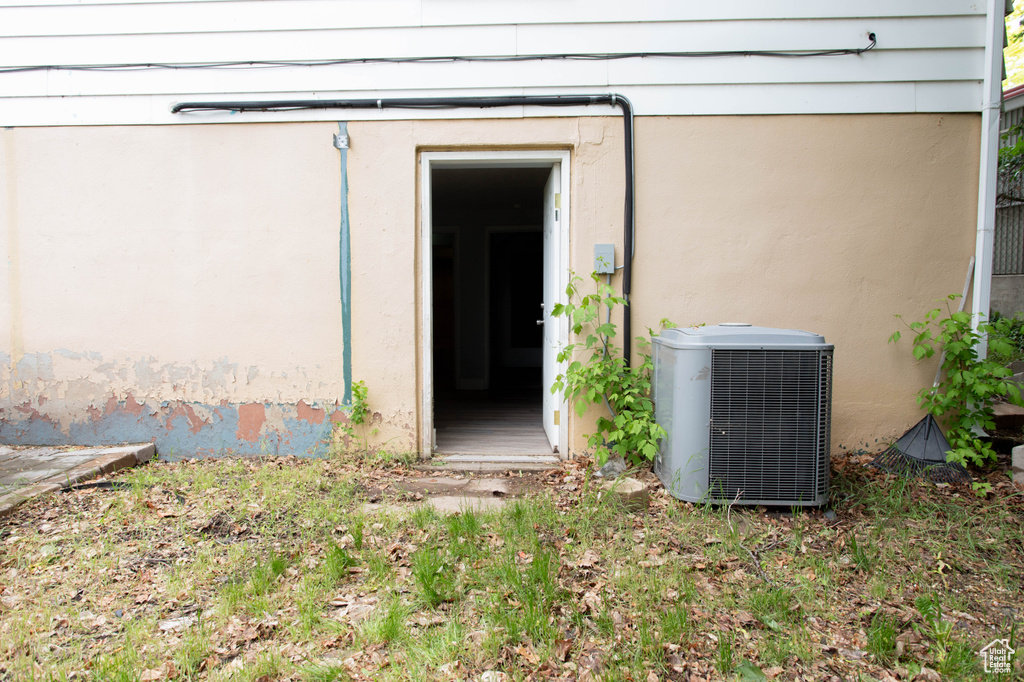 Doorway to property with cooling unit