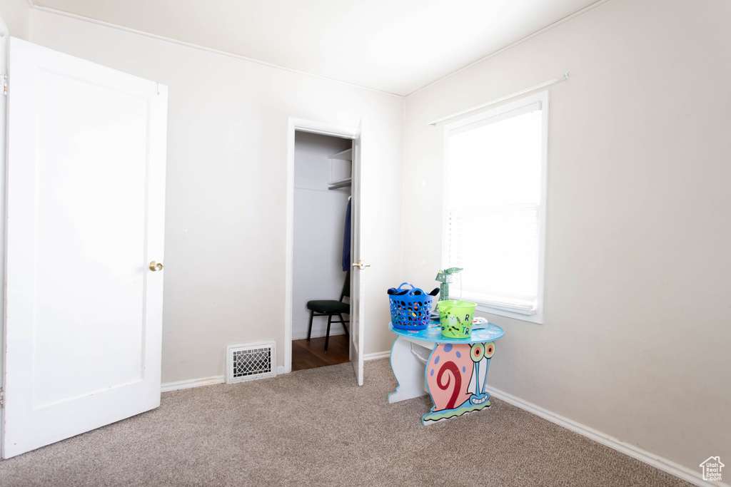Game room featuring carpet flooring and baseboards