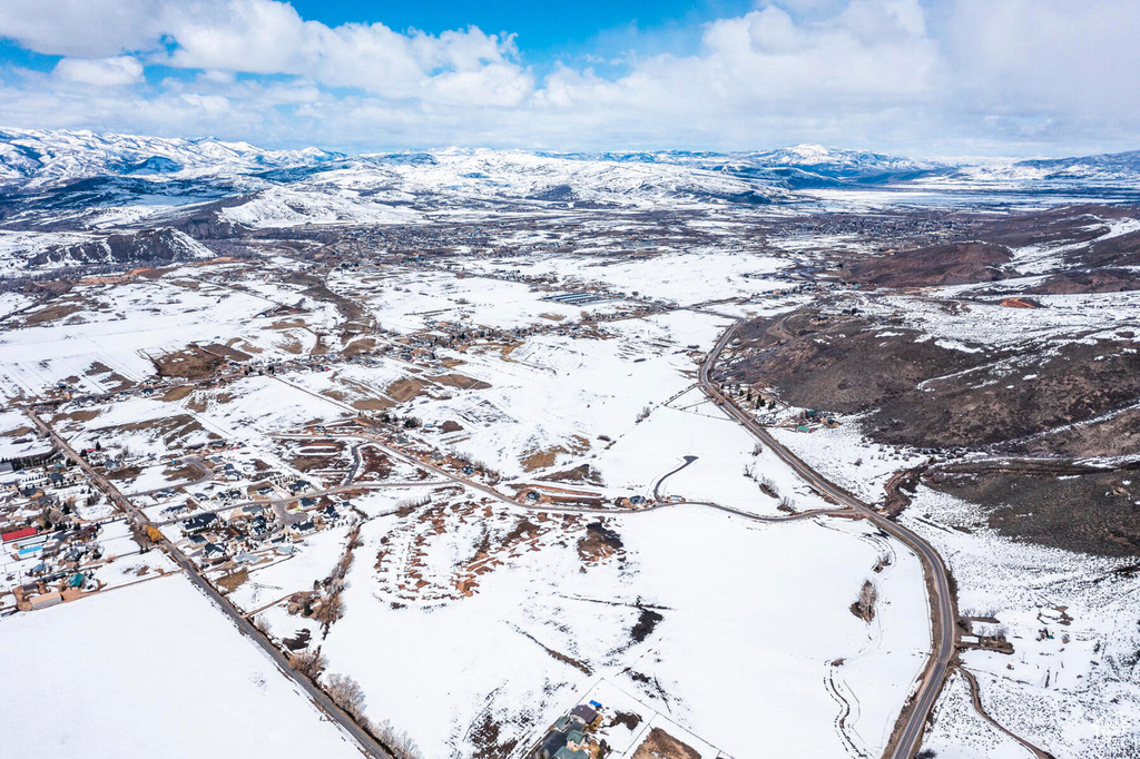Snowy aerial view with a mountain view