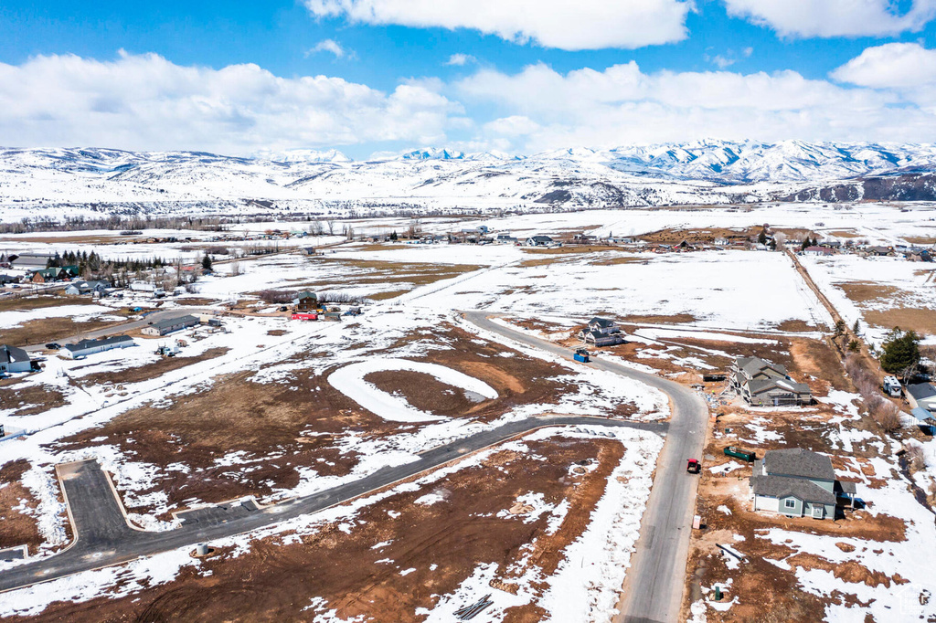 Snowy aerial view with a mountain view