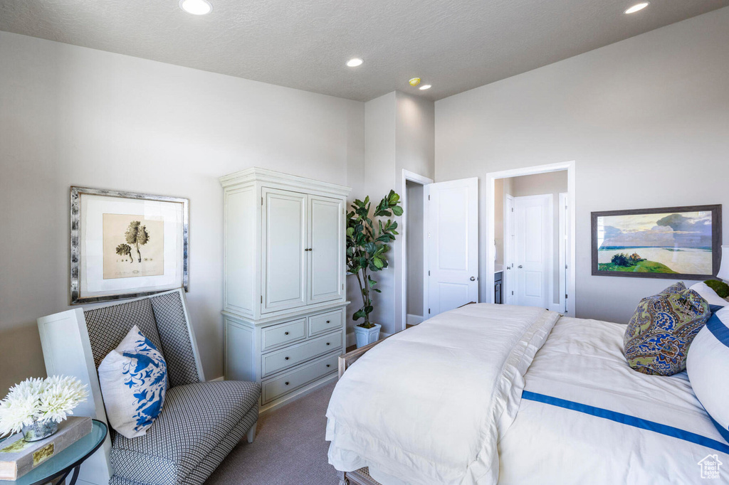 Carpeted bedroom featuring recessed lighting