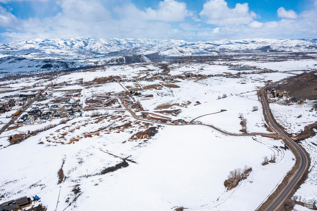 Snowy aerial view with a mountain view