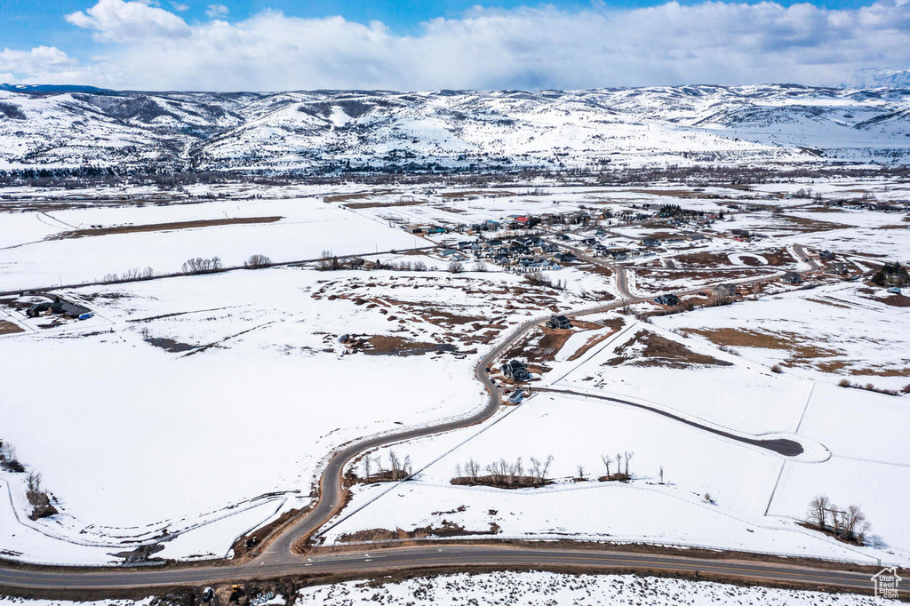 Snowy aerial view with a mountain view