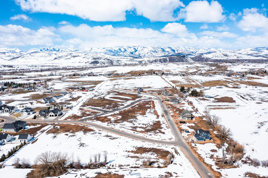 Snowy aerial view with a mountain view