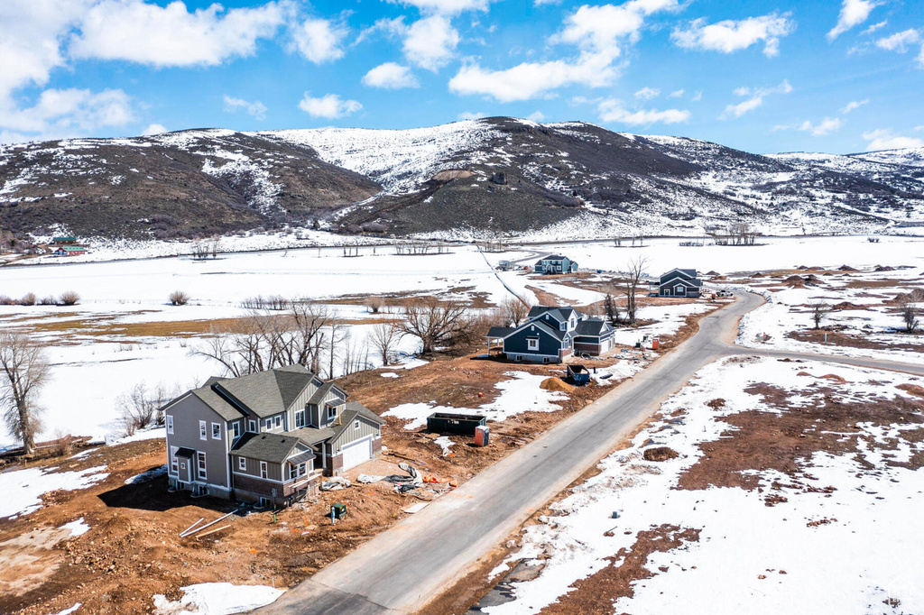Snowy aerial view featuring a mountain view