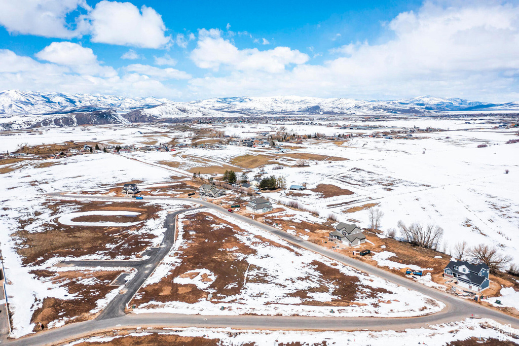 Snowy aerial view with a mountain view