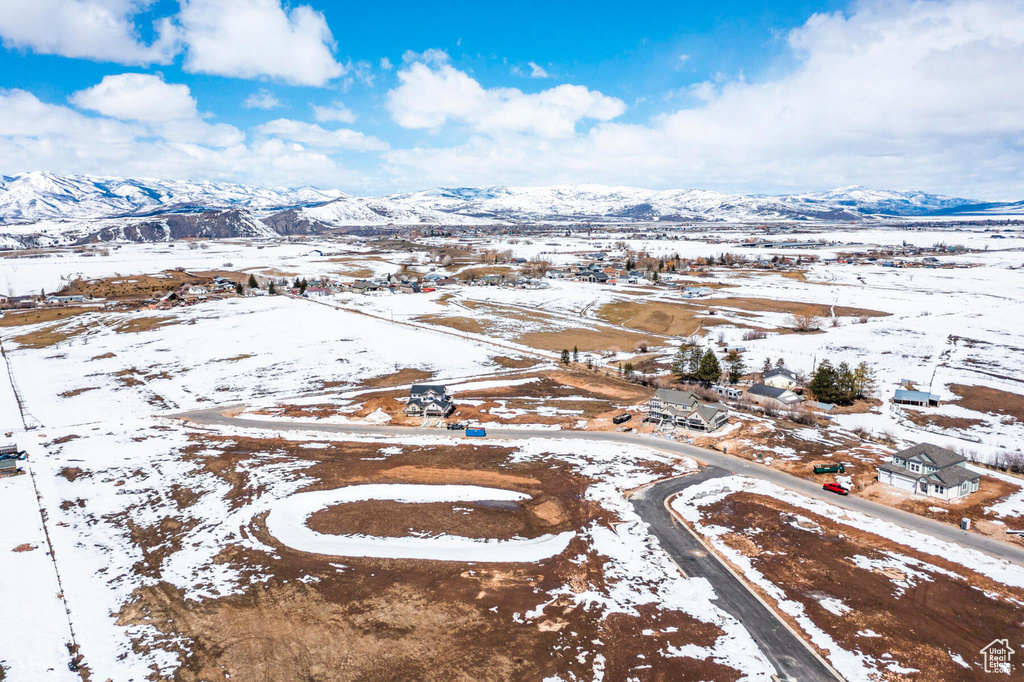 Snowy aerial view with a mountain view
