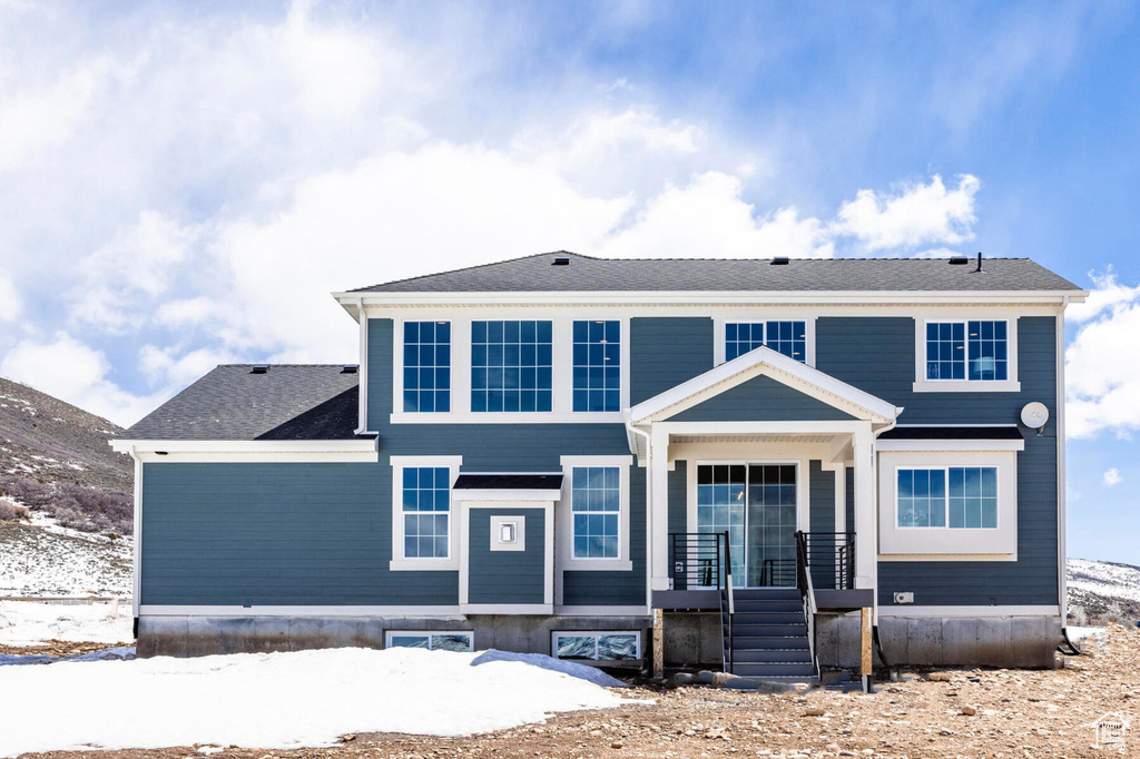 View of front of property with a mountain view