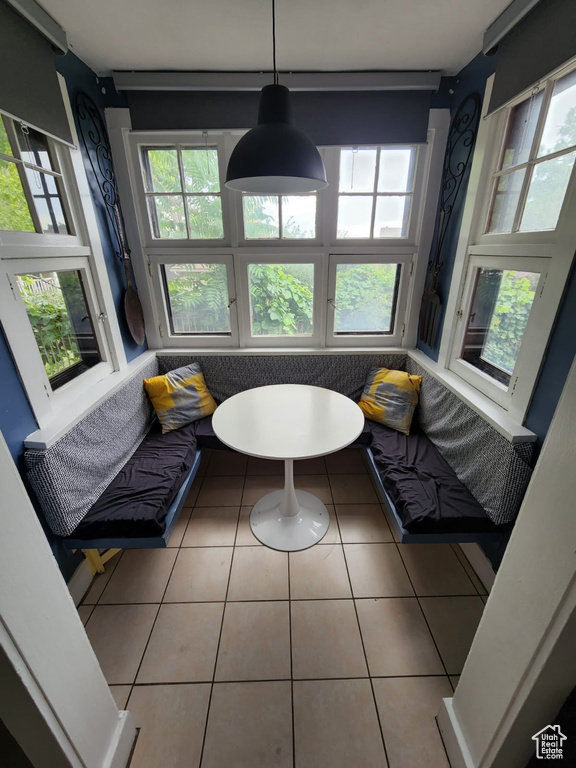 Sunroom / solarium featuring plenty of natural light and french doors