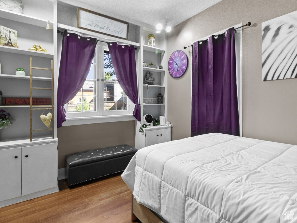 Bedroom with wood finished floors