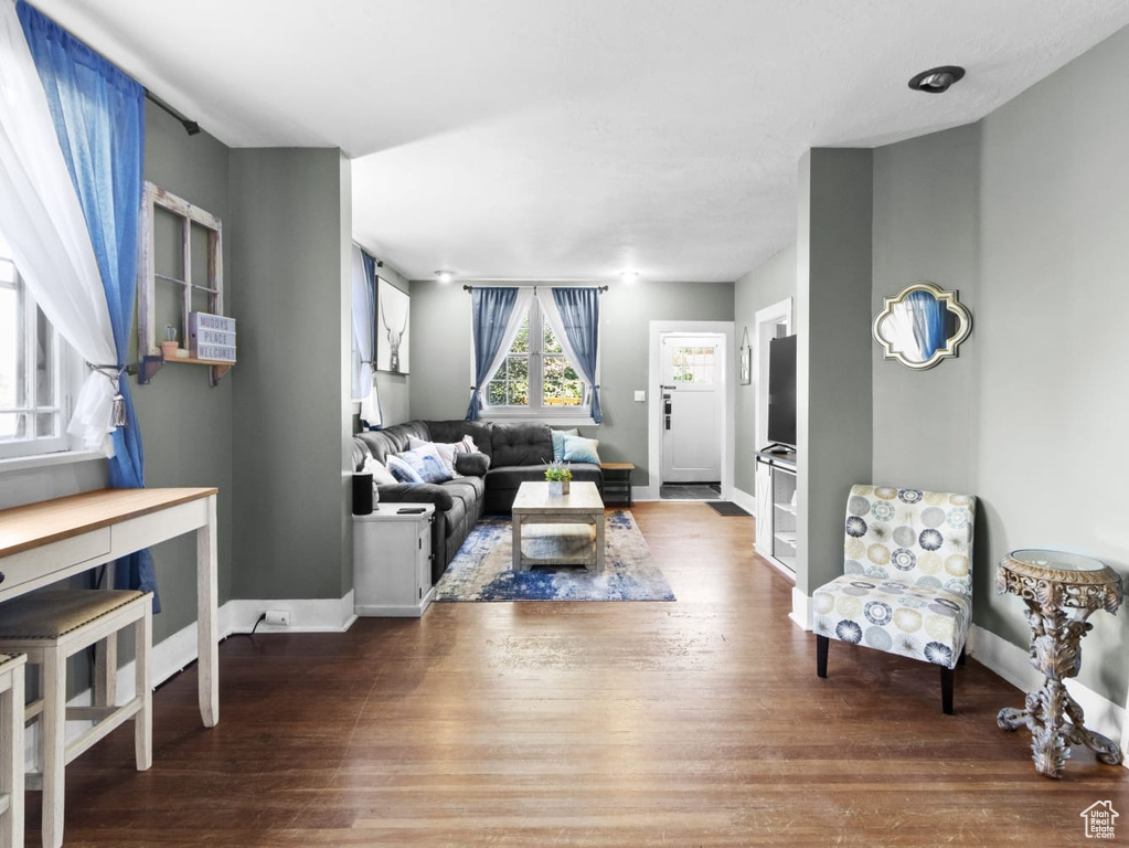 Living room with wood finished floors and baseboards