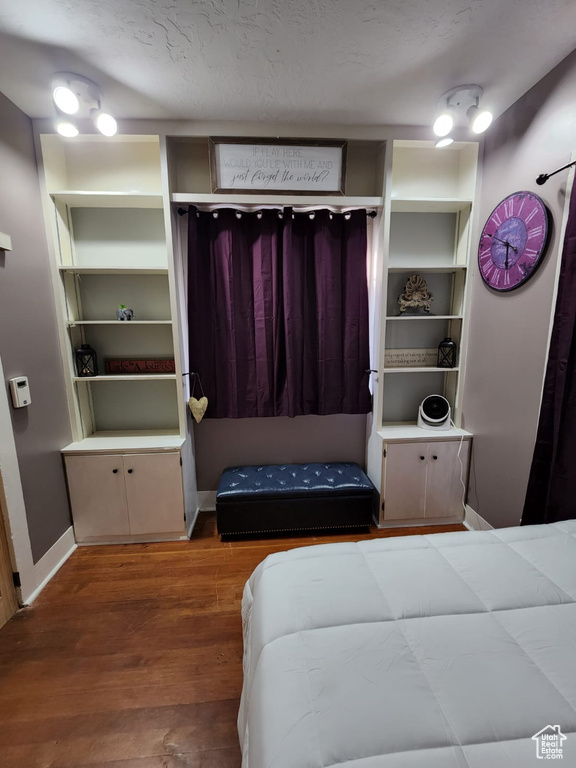 Bedroom featuring wood finished floors