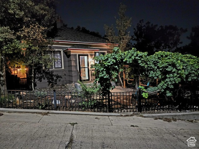 View of property hidden behind natural elements