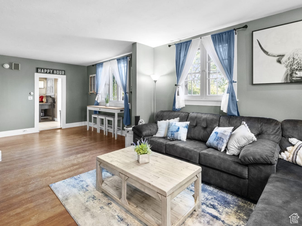 Living room with wood finished floors and baseboards